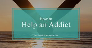 two people holding hands at ocean - how to help an addict