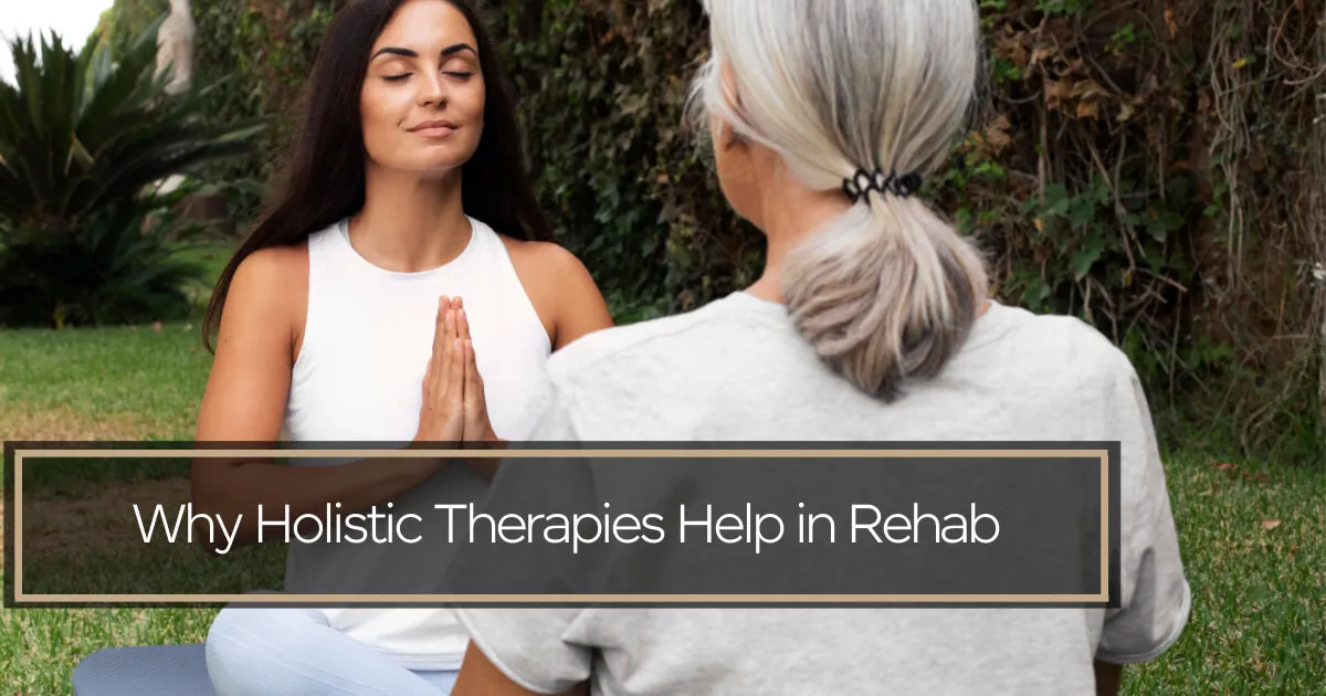 Two woman meditating outdoors.
