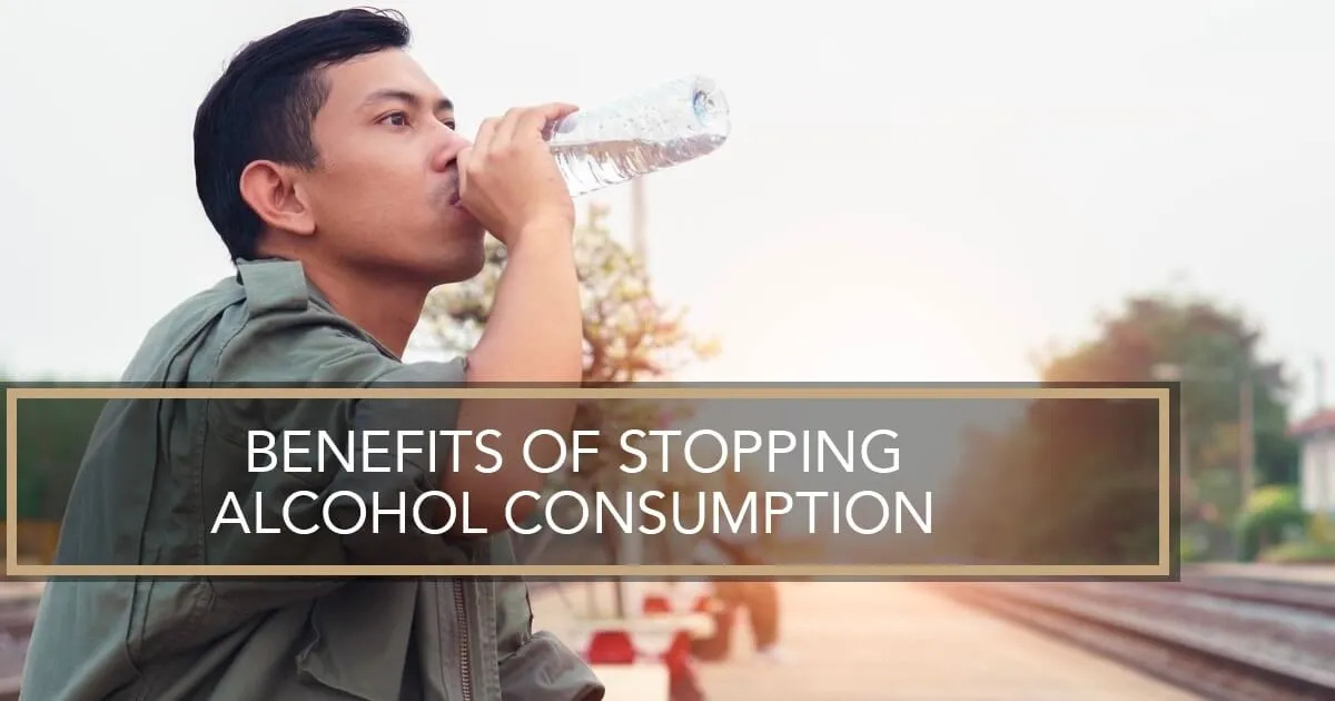 A man drinking bottle water.